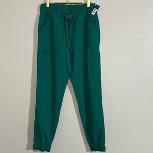 Women’s Jaanuu Mesh Enhanced jogger pant size small NWT Hunter Green NWT